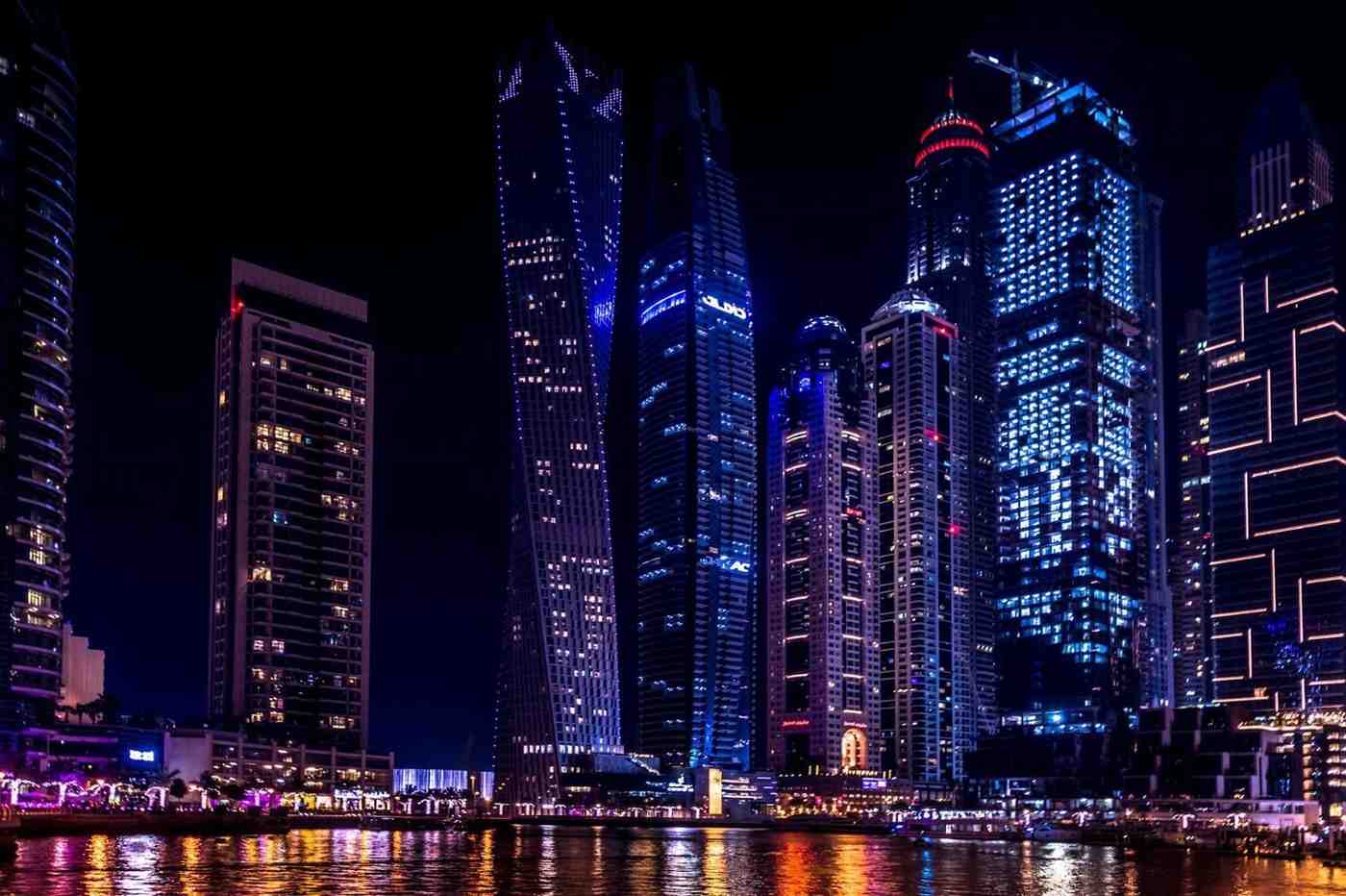 AI development company in Dubai downtown skyline at night where leading artificial intelligence firms serve UAE enterprises